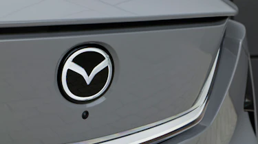 Mazda CX-6e - Mazda badge