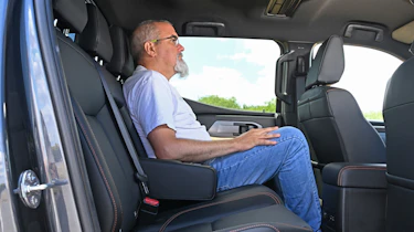 Auto Express senior test editor Dean Gibson sitting in the Mitsubishi L200's rear seat