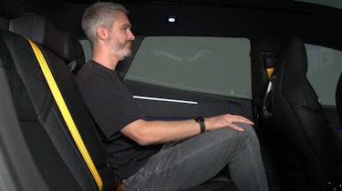 Auto Express deputy editor Richard Ingram sitting in the Polestar 4's rear seat