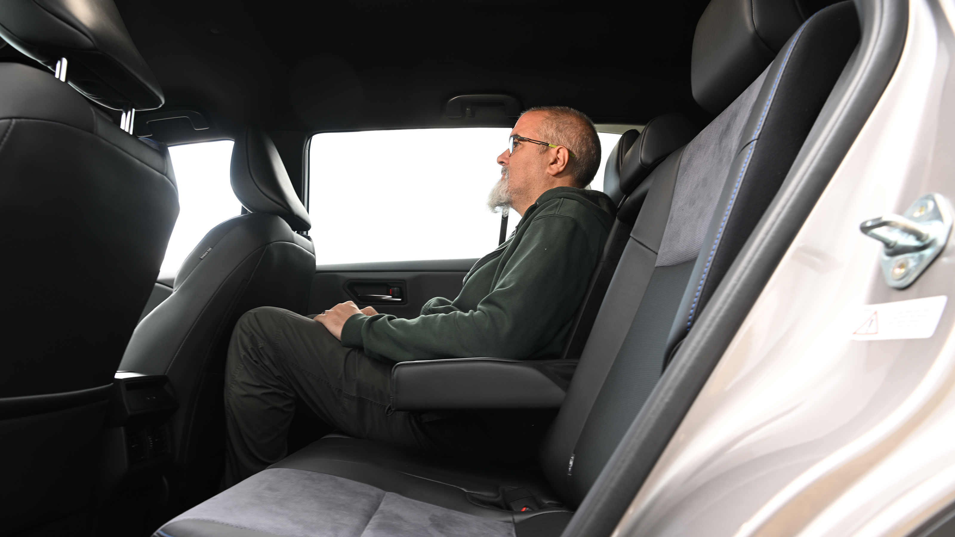 Auto Express senior road test editor Dean Gibson sitting in the Toyota RAV4's rear seat