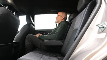 Auto Express senior road test editor Dean Gibson sitting in the Toyota RAV4's rear seat