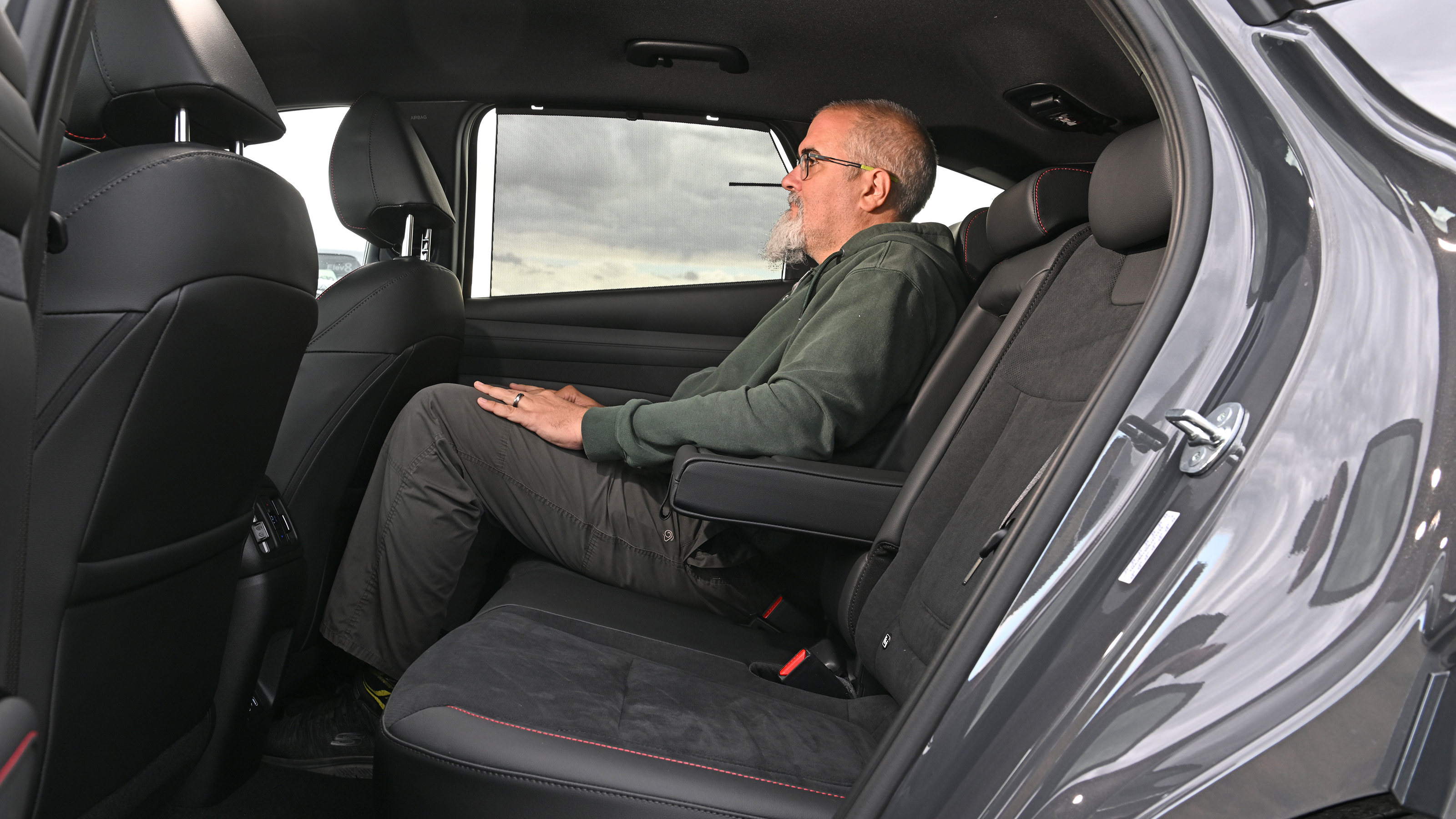 Auto Express senior road test editor Dean Gibson sitting in the Hyundai Tucson's rear seat