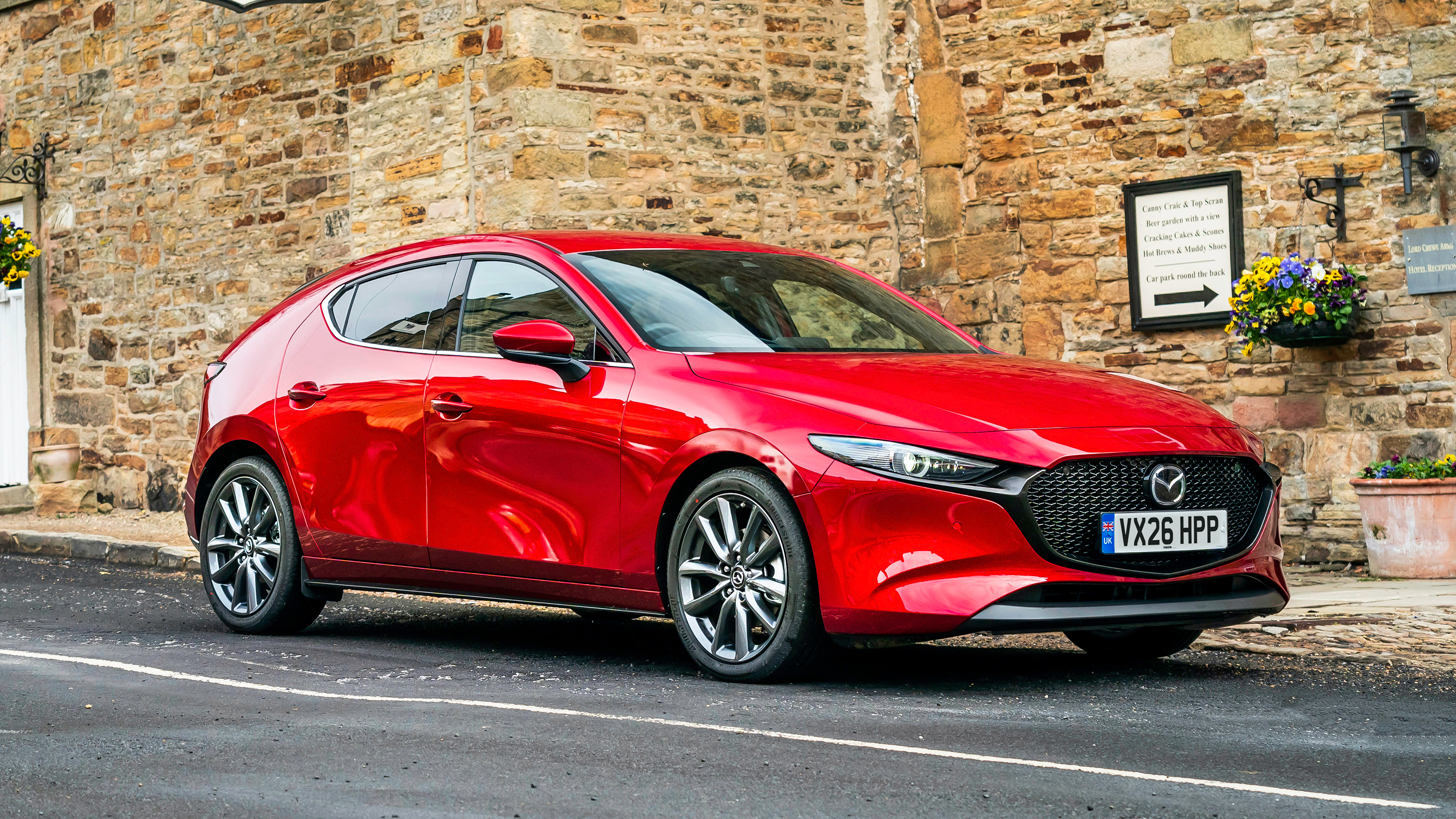 2027 Mazda 3 - red front angled