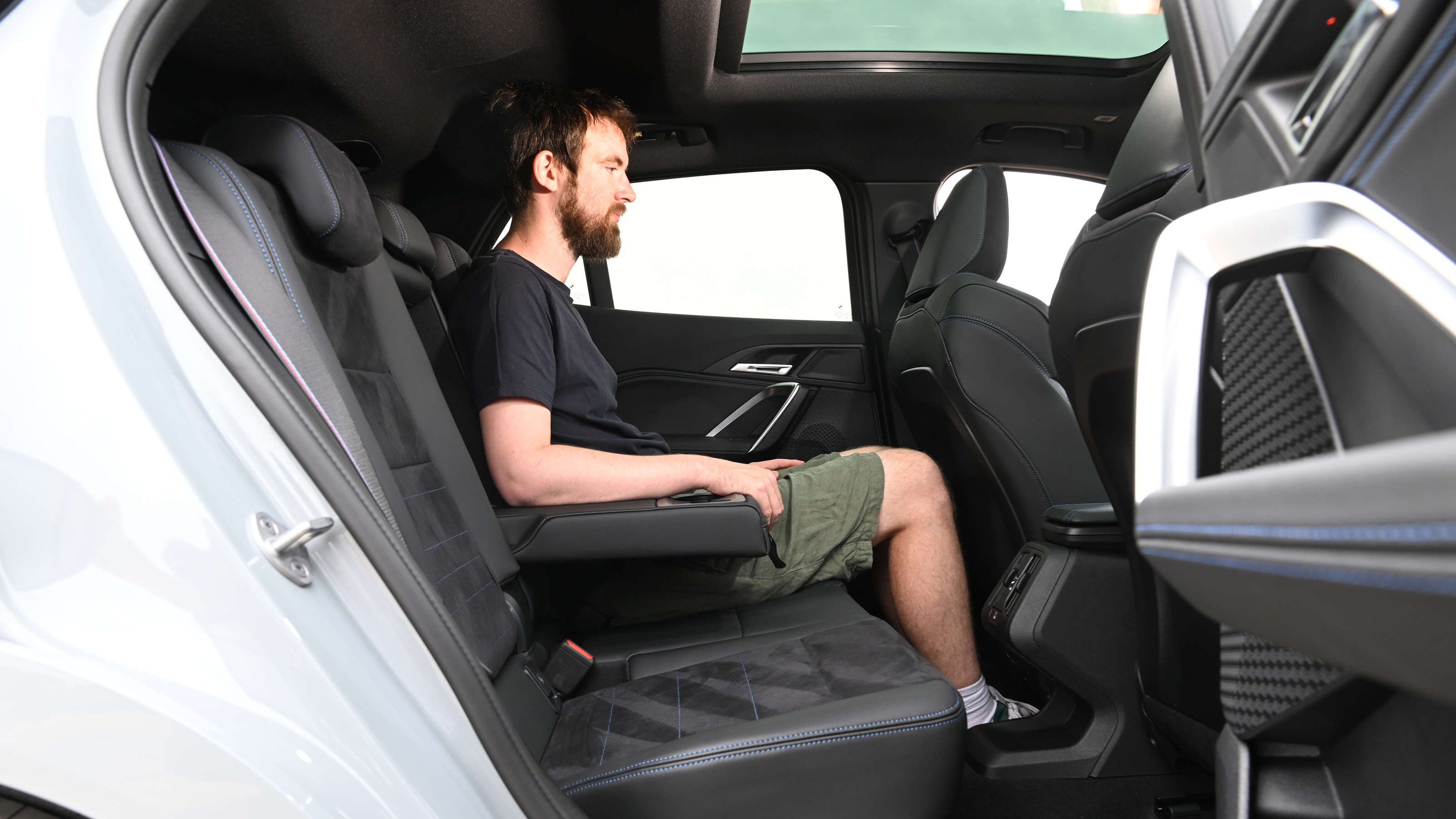 Auto Express contributor Sam Naylor sitting in the BMW X2's rear seat