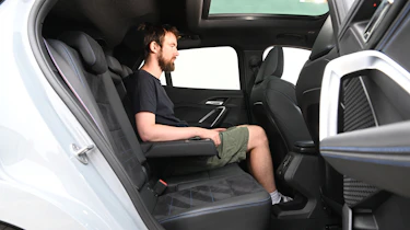 Auto Express contributor Sam Naylor sitting in the BMW X2's rear seat