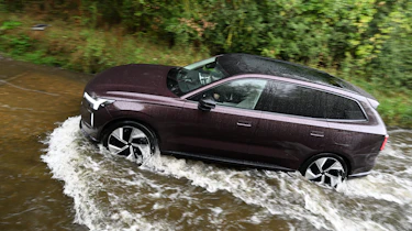Volvo EX90 driving through deep water