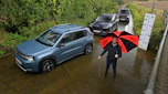 Auto Express consumer reporter Tom Jervis standing next to a selection of cars in a ford