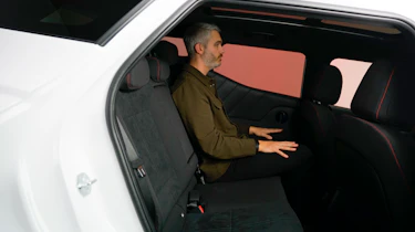 Richard Ingram sat in the back of the Hyundai Bayon