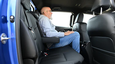 Auto Express senior road test editor Dean Gibson sitting in the Isuzu D-Max's rear seat