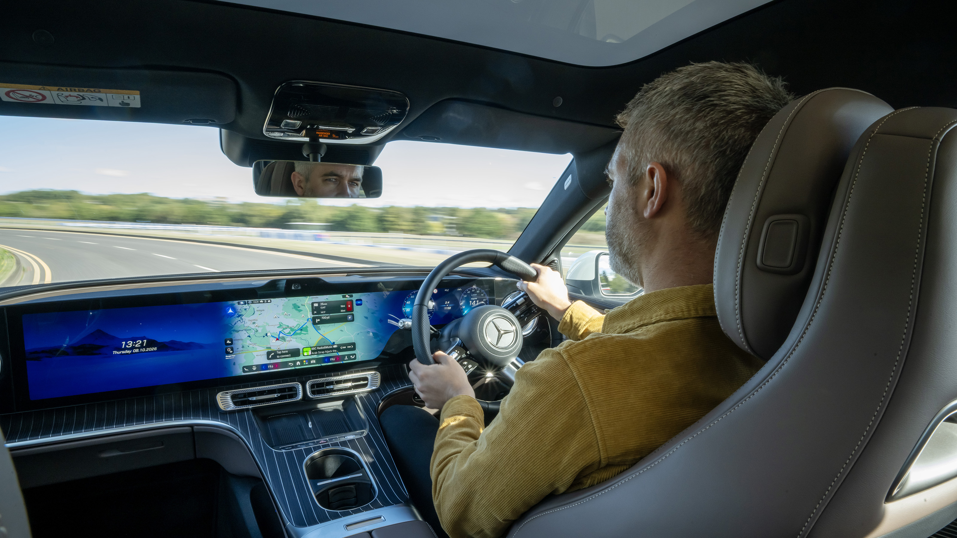 Mercedes C-Class Electric UK - interior, car being driven by Auto Express deputy editor Richard Ingram