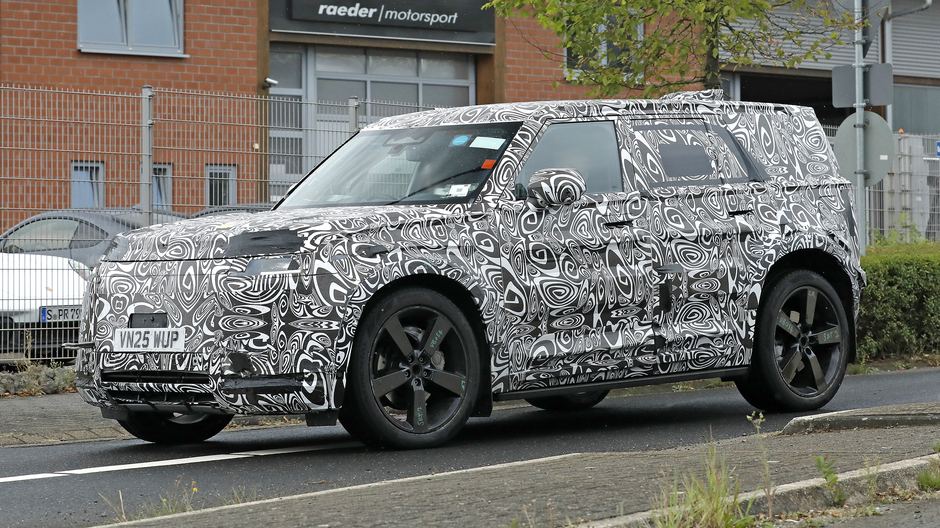 New Land Rover Defender Sport - road front angled 
