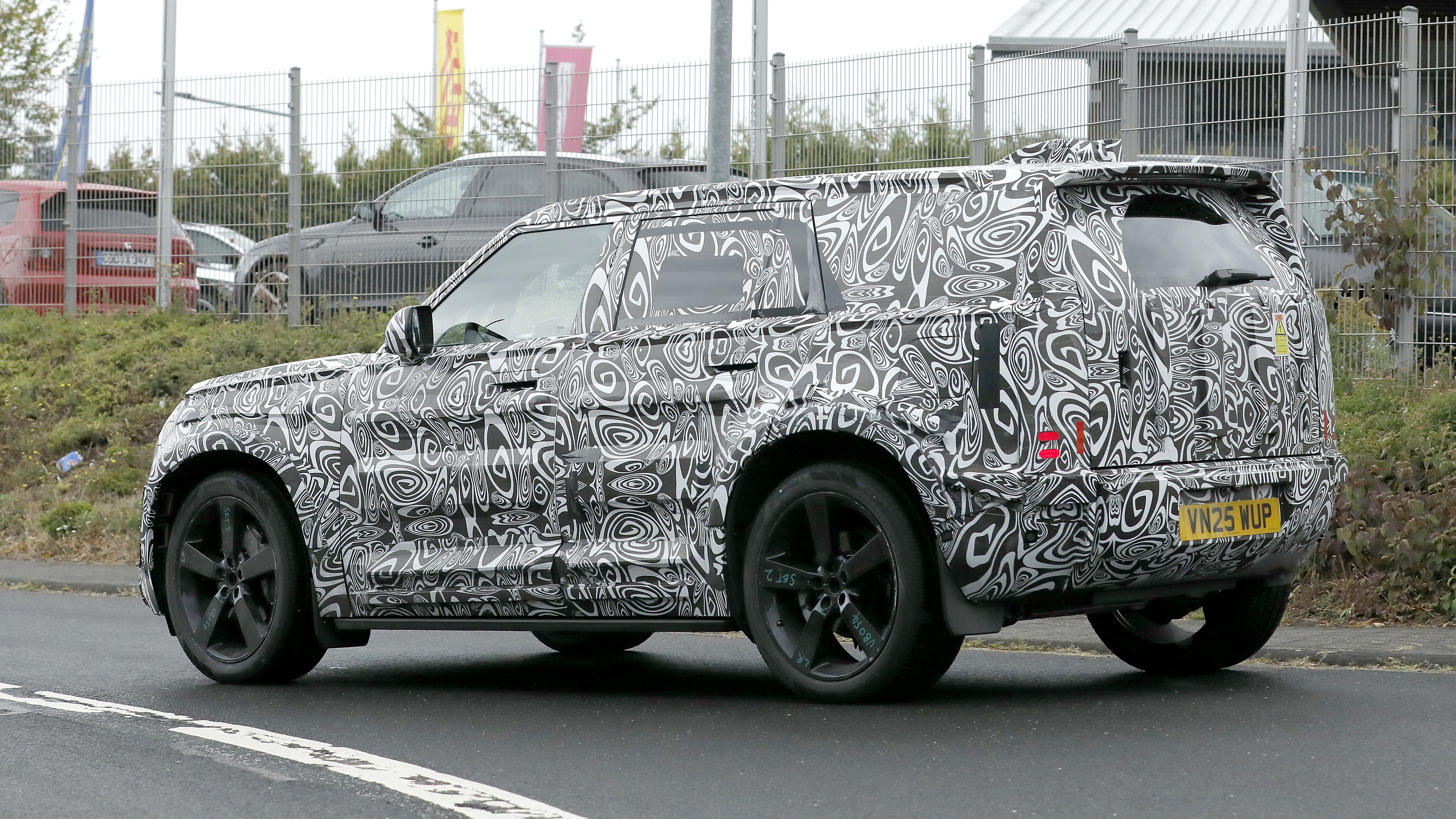 New Land Rover Defender Sport - road rear angled