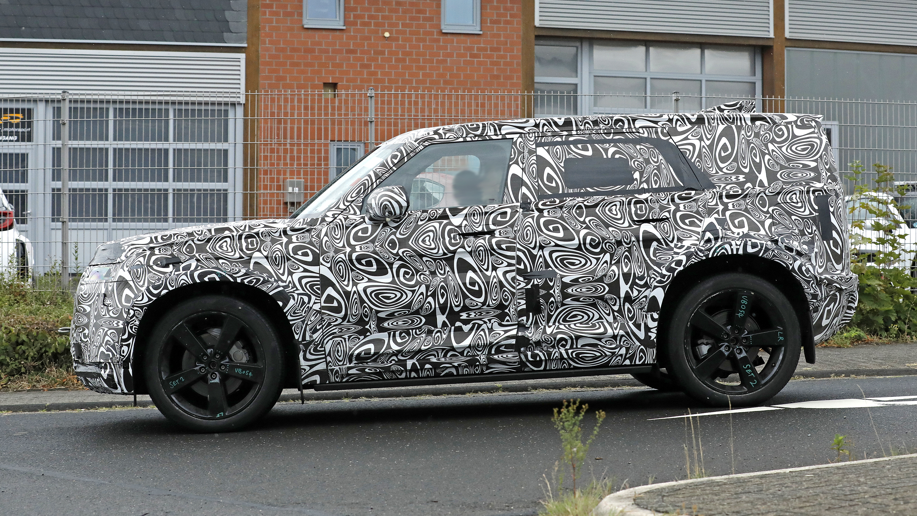 New Land Rover Defender Sport - road side profile