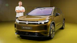 New Volkswagen ID. Tiguan - front static with Auto Express senior news reporter Alastair Crooks stood next to the car
