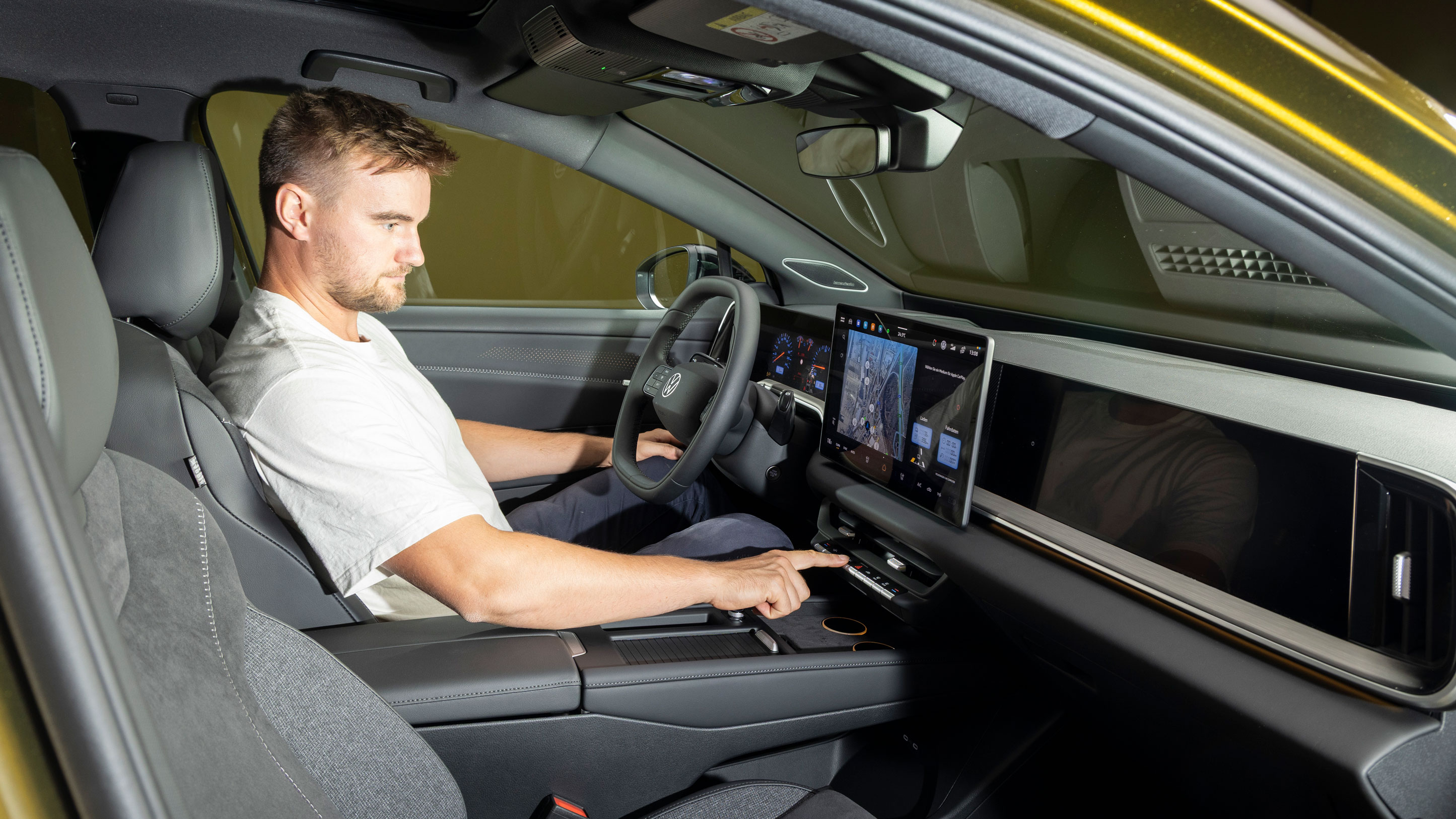 New Volkswagen ID. Tiguan - front interior with Auto Express senior news reporter Alastair Crooks sat insider