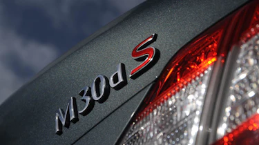 Infiniti M30d badge
