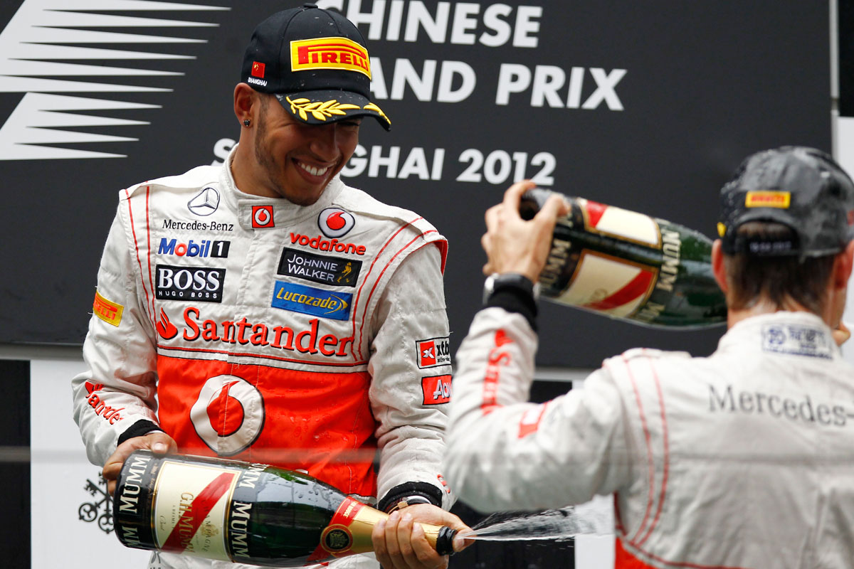 Lewis and Jenson celebrate on the podium
