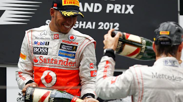 Lewis and Jenson celebrate on the podium