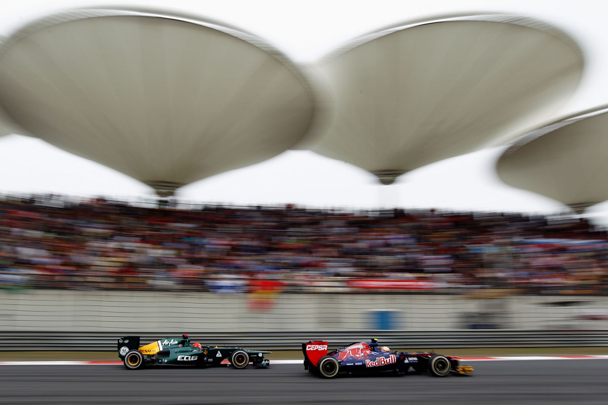 Jean-Eric Vergne ahead of Heikki Kovalainen