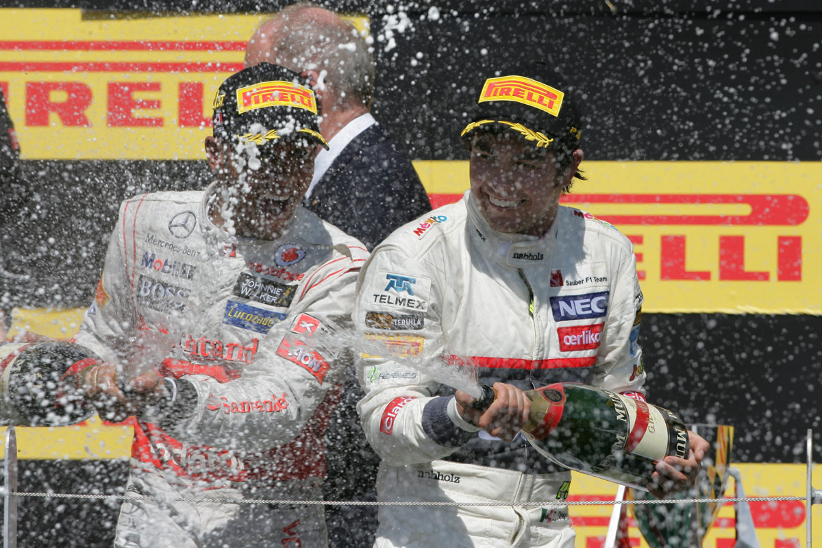 Lewis Hamilton and Sergio Perez celebrate