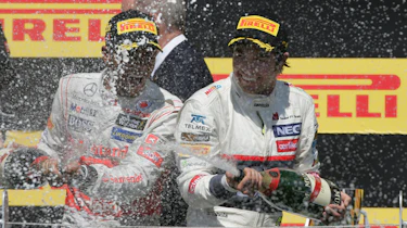 Lewis Hamilton and Sergio Perez celebrate