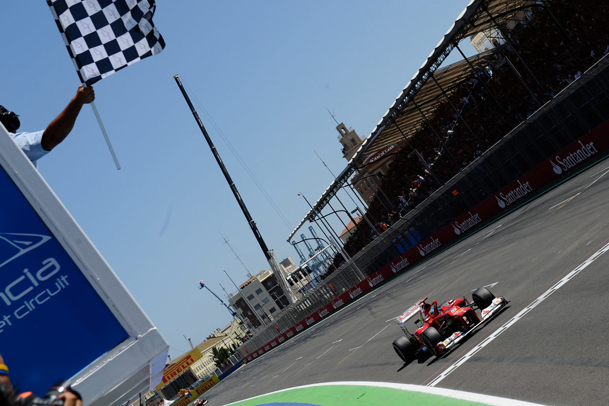 Fernando Alonso crosses the finish line