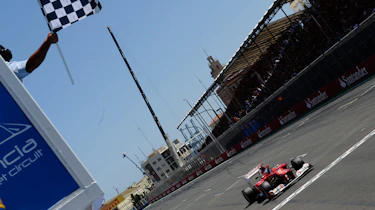 Fernando Alonso crosses the finish line