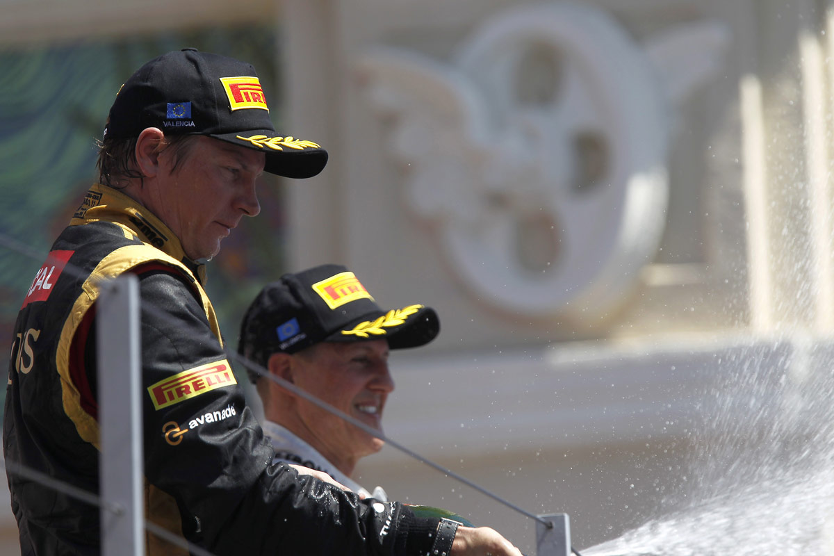 Kimi Raikkonen and Michael Schumacher celebrate