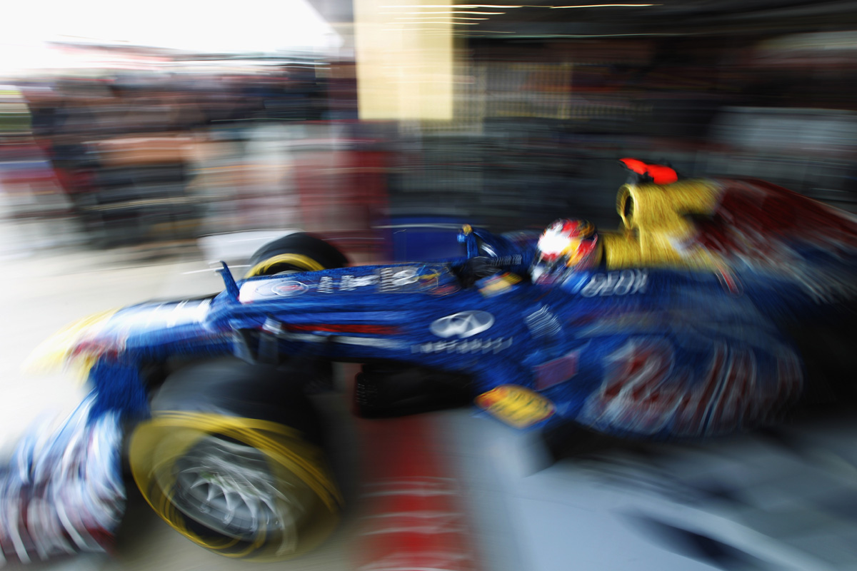 Sebastian Vettel exits his garage