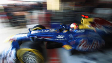 Sebastian Vettel exits his garage