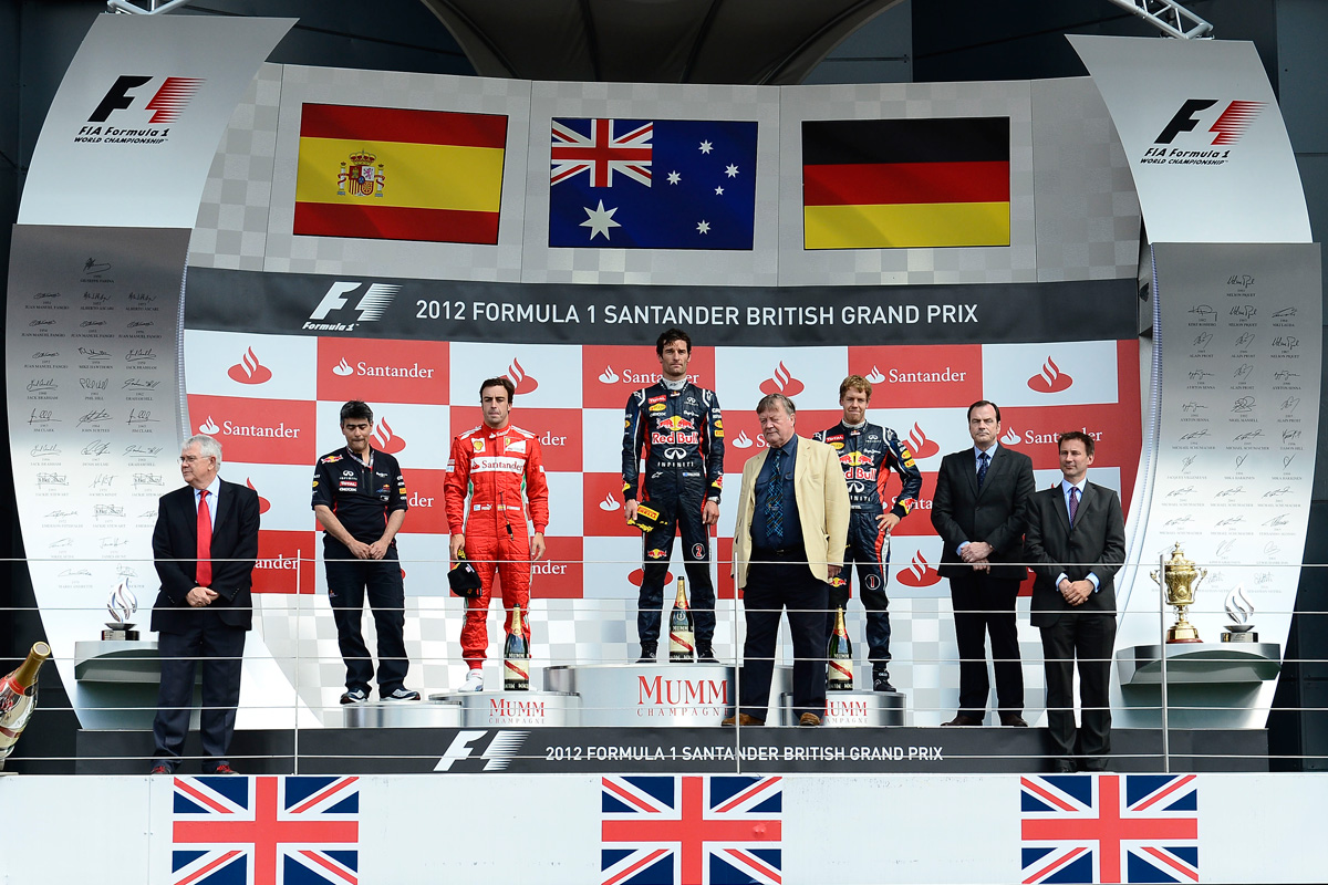 Fernando Alonso, Mark Webber and Sebastian Vettel on the new podium