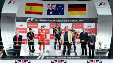 Fernando Alonso, Mark Webber and Sebastian Vettel on the new podium