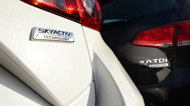 Volkswagen Golf vs Mazda 3 badges