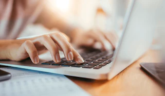 Person typing on a laptop